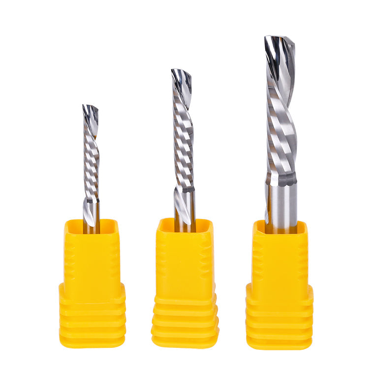 Three drill bits with yellow handles on a white background.